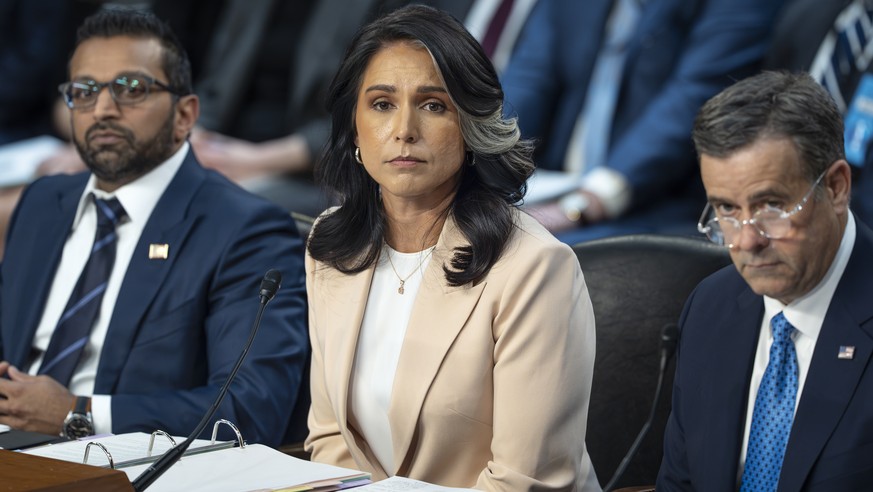 Director of National Intelligence Tulsi Gabbard, center, is flanked by FBI Director Kash Patel, left, and CIA Director John Ratcliffe, as the Senate Intelligence Committee holds its worldwide threats  ...