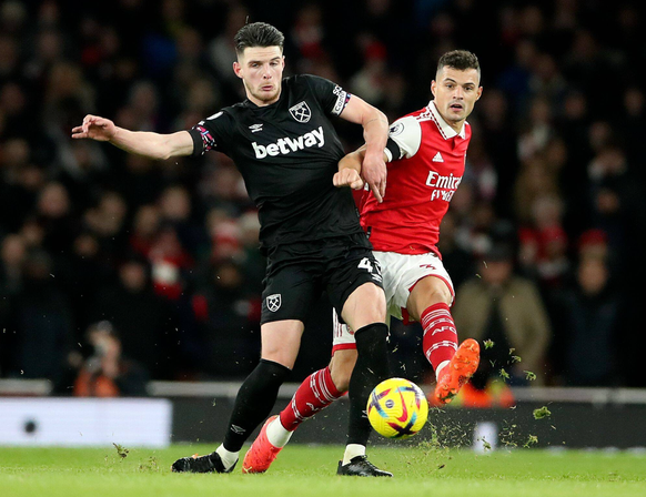 Mandatory Credit: Photo by Matt Impey/Shutterstock (13685711ak) Declan Rice of West Ham United and Granit Xhaka of Arsenal compete for the ball Arsenal v West Ham United Football, Premier League, Emir ...