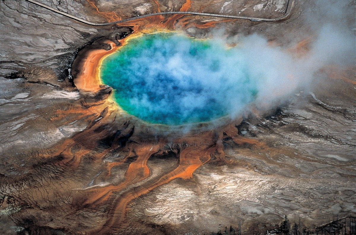 This undated photo provided by Robert B. Smith shows the Grand Prismatic hot spring in Yellowstone National Park's that is among the park's myriad hydrothermal features created by the fact t ...