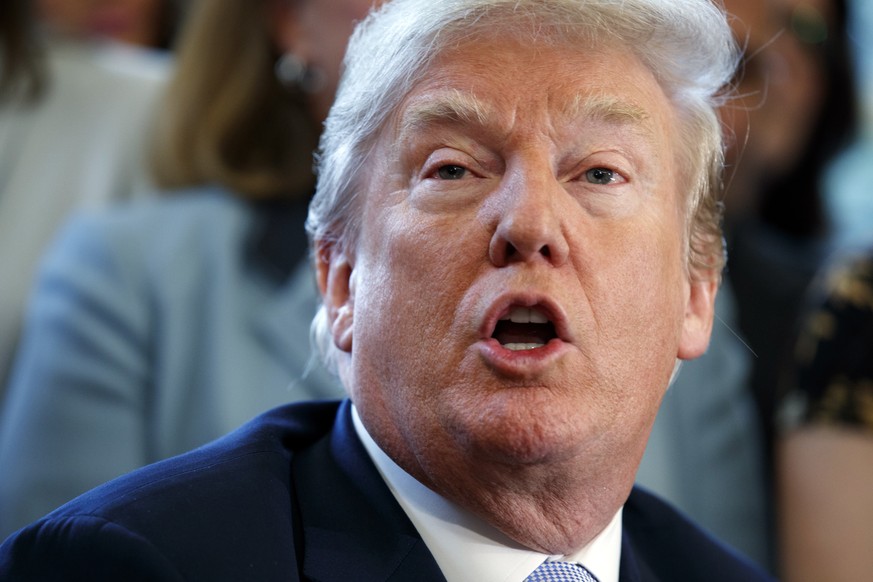 President Donald Trump speaks in the Oval Office at the White House before signing a new law aimed at curbing six trafficking Wednesday, April 11, 2018, in Washington. (AP Photo/Evan Vucci)