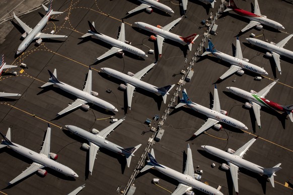 epa08076016 (FILE) - Boeing 737 Max 8 aircraft sit parked at Boeing Field in Seattle, Washington, USA, 21 July 2019 (reissued 16 December 2019). According to reports on 16 December 2019, Boeing will s ...