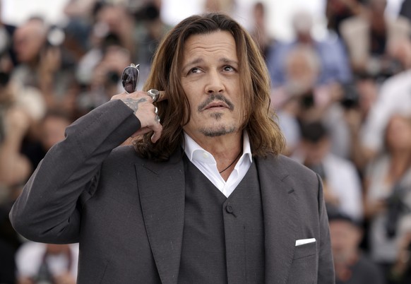 Johnny Depp poses for photographers during the photo call for the film 'Jeanne du Barry' at the 76th International Film Festival, Cannes, South of France, Wednesday, May 17, 2023. (Photo by Vian…
