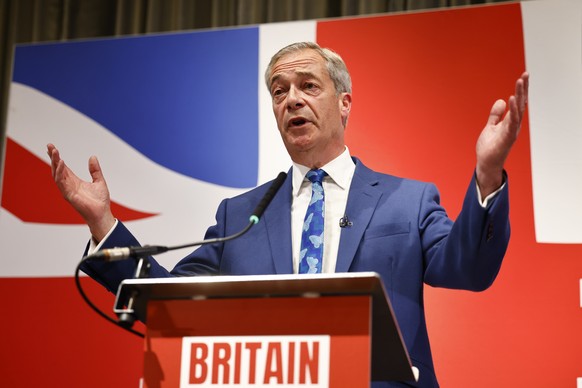 epa11387685 The new leader of Reform UK and prospective parliamentary candidate for Clacton Nigel Farage speaks during a press conference for the Reform UK party at the Glaziers Hall in London, Britai ...