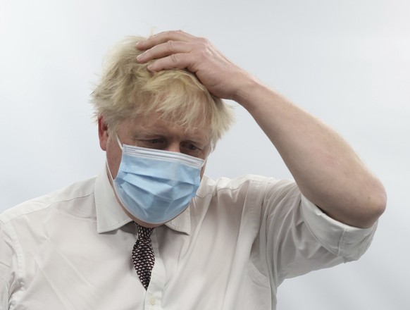 FILE - Britain&#039;s Prime Minister Boris Johnson gestures during a visit to Finchley Memorial Hospital, in North London, Tuesday, Jan. 18, 2022. London police say they are now investigating Downing  ...