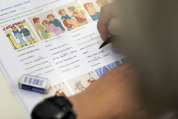 A pupil of class 2A pictured during a French lesson with teacher Astrid Marchetto-Spies (not in the picture) at the gymnasium of the Cantonal School Glarus, Switzerland, on May 17, 2018. The Cantonal  ...