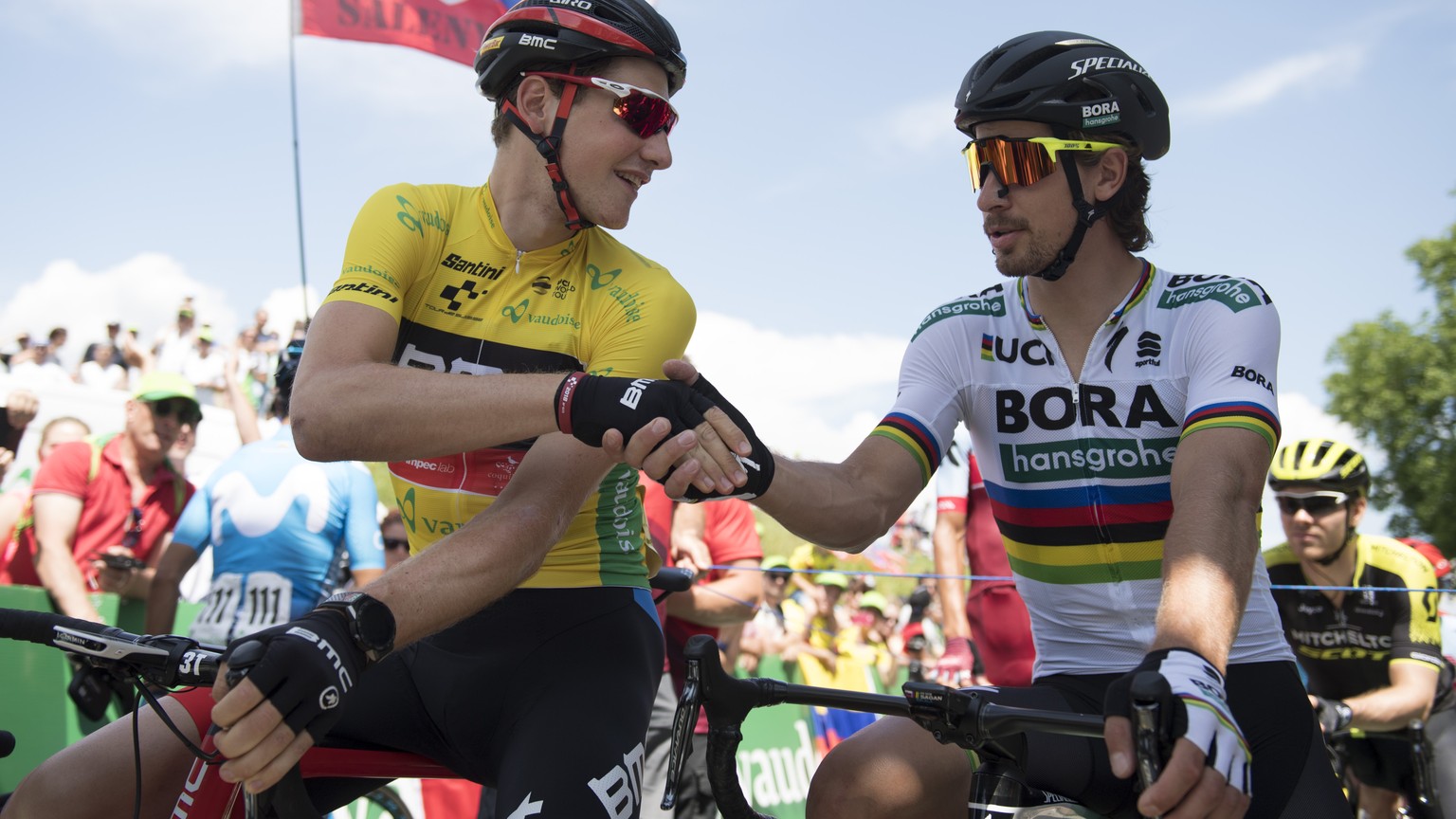 Switzerland&#039;s Stefan Kueng of BMC Racing Team in the yellow leader jersey, left, and Slovakia&#039;s Peter Sagan of the Bora-Hansgrohe Team, right, before the 2nd stage, a 155 km round course in  ...