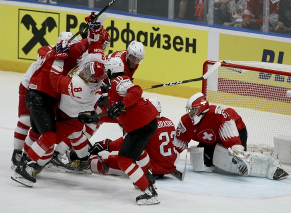 Swiss and Russia players in action during the Ice Hockey World Championships group B match between Switzerland and Russia at the Ondrej Nepela Arena in Bratislava, Slovakia, Sunday, May 19, 2019. (AP Photo/Ronald Zak)