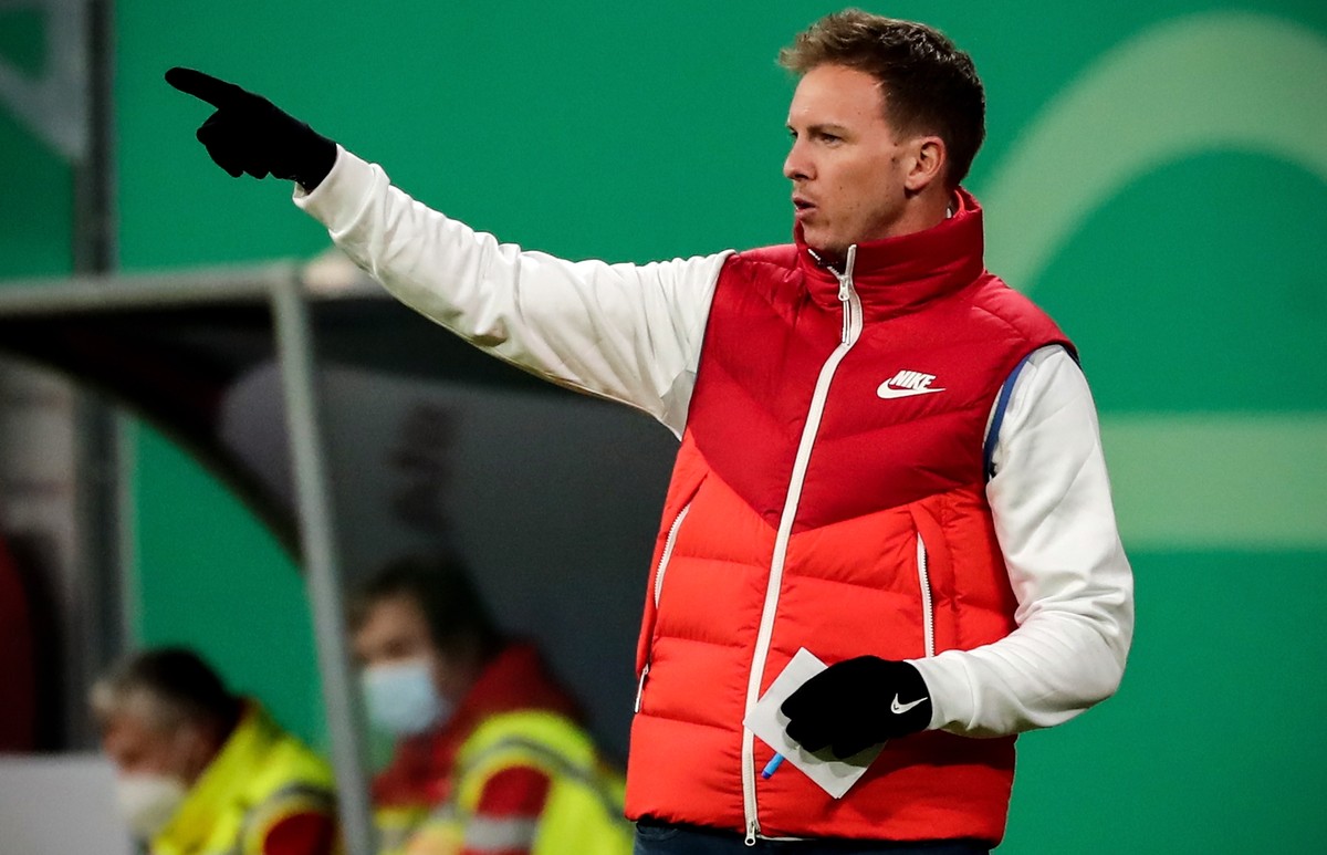 epa09050030 Leipzig's head coach Julian Nagelsmann gestures during the German DFB Cup quarter final soccer match between RB Leipzig and VfL Wolfsburg in Leipzig, Germany, 03 March 2021. EPA/FILIP ...