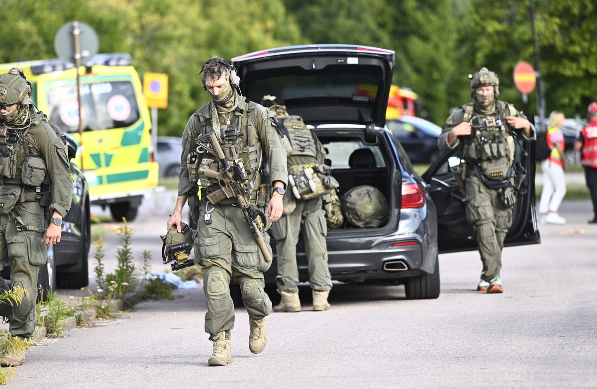 Police and emergency personnel outside Brinellskolan during a major emergency response after a man with a sword reportedly injured several people at the school in Fagersta, Sweden, Friday, Aug. 21, 20 ...