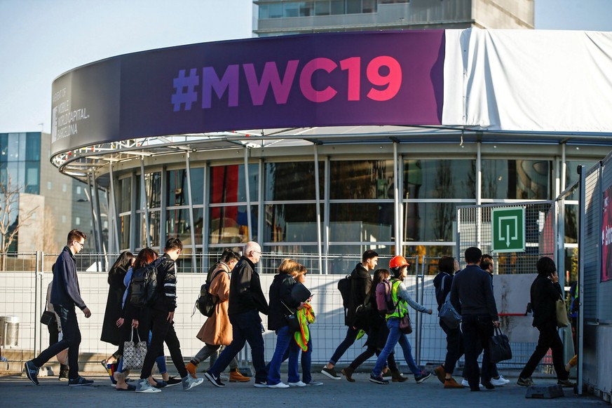 epa07389841 Staff and participants arrive to the Fira Barcelona Montjuic during preparations for the Mobile World Congress 2019 (MWC19) in Barcelona, Spain, 23 February 2019. The leading, global techn ...