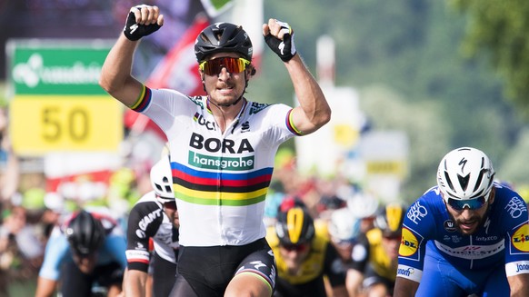 epa06799013 Slovakian rider Peter Sagan (C) of the Bora–Hansgrohe team celebrates after winning the second stage of the 82nd Tour de Suisse UCI ProTour cycling race, a 155km round course in Frauenfeld ...