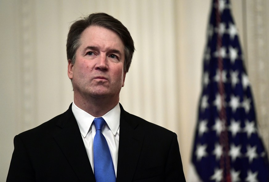 FILE - In this Oct. 8, 2018, file photo, Supreme Court Justice Brett Kavanaugh stands before a ceremonial swearing-in in the East Room of the White House in Washington. At least two Democratic preside ...