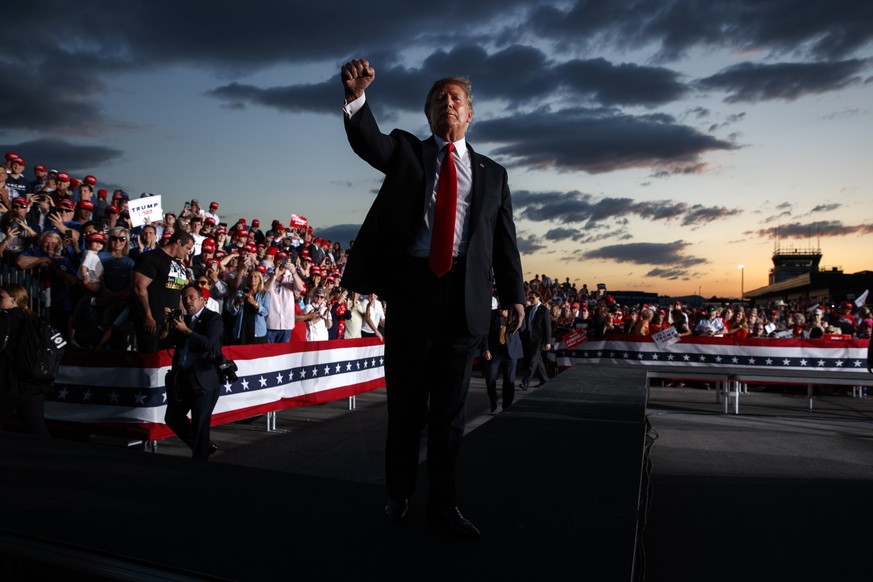 President Donald Trump pumps his fist to the crowd after speaking to a campaign rally in Montoursville, Pa. (AP Photo/Evan Vucci)