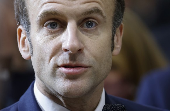 FILE - French President Emmanuel Macron meets representatives of the agricultural world after a speech as he visits the International Agriculture Fair, in Paris, Feb. 26, 2022. Macron has on Thursday, ...