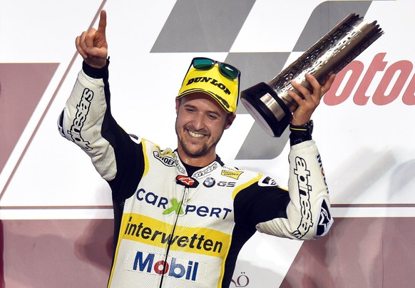 epa05872285 Swiss Moto2 rider Thomas Luthi of the CarXpert Interwetten team celebrates on the podium after taking the second place in the Moto2 race of the Motorcycling Grand Prix of Qatar at Al Losai ...