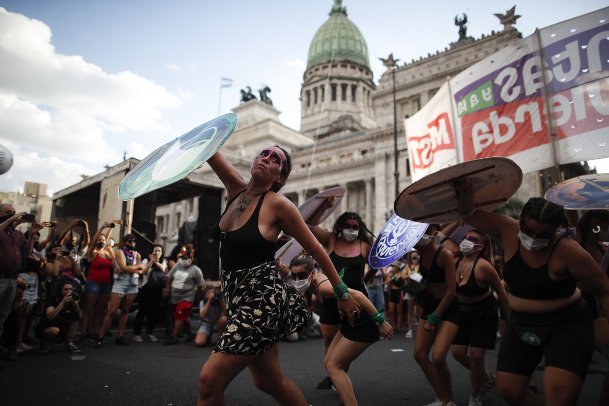 Women perform during a demonstration to mark the International Women' Day in Buenos Aires, Argentina, Monday, March 8, 2021. (AP Photo/Natacha Pisarenko)