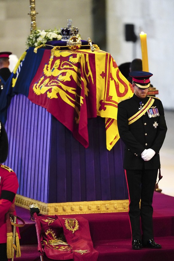 Prince Harry participates in the vigil of the Queen&#039;s grandchildren around the coffin, as it lies in state on the catafalque in Westminster Hall, at the Palace of Westminster, London, Saturday, S ...