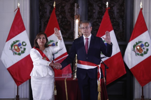 epa10359875 Peruvian President Dina Boluarte (L) poses with the appointed prime minister Pedro Miguel Angulo Arana during a ceremony at the Palacio de Gobierno, in Lima, Peru, 10 December 2022. EPA/Pa ...