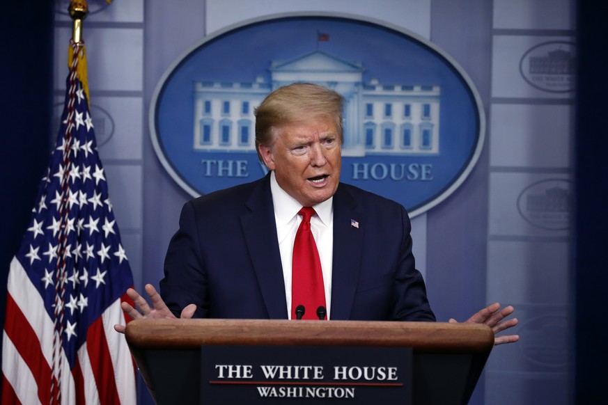 FILE - In this April 22, 2020, file photo President Donald Trump speaks about the coronavirus in the James Brady Press Briefing Room of the White House in Washington. After two months of frantic respo ...