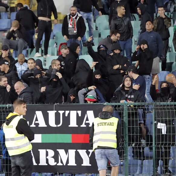 EDS NOTE OBSCENE GESTURES - Bulgarian fans gesture as they stand in the stadium to watch the Euro 2020 group A qualifying soccer match between Bulgaria and England, at the Vasil Levski national stadiu ...