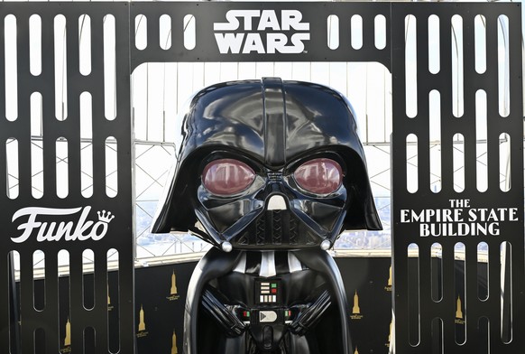 A Funko Darth Vader toy character installation is part of the Star Wars themed Empire State Building takeover on Thursday, March 21, 2024, in New York. (Photo by Evan Agostini/Invision/AP)