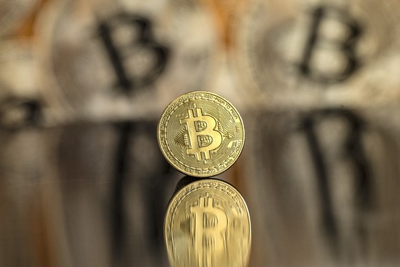 epa11734561 An illustration shows a symbolic Bitcoin, in Lugano, Switzerland, 22 November 2024. The world&#039;s most popular cryptocurrency hit a record high on 21 November, approaching the 100,000 U ...