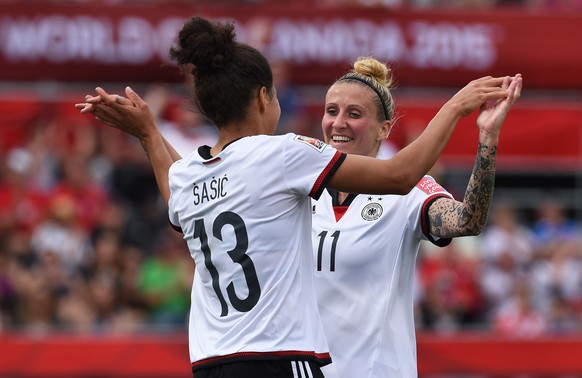 epa04788693 Germany&#039;s Celia Sasic (L) celebrates with her teammate Anja Mittag (R) after scoring the opening goal during the FIFA Women&#039;s World Cup 2015 group B soccer match between Germany  ...
