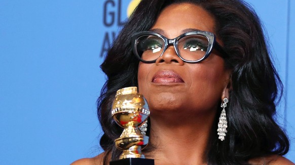 epaselect epa06424215 Oprah Winfrey holds the 2018 Golden Globe Cecil B. DeMille Award in the press room during the 75th annual Golden Globe Awards ceremony at the Beverly Hilton Hotel in Beverly Hill ...