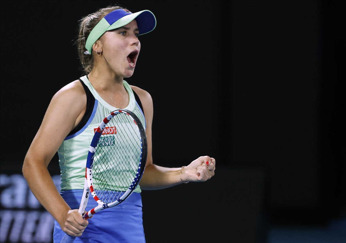 Sofia Kenin of the U.S. reacts after winning a point against Spain's Garbine Muguruza during the women's final at the Australian Open tennis championship in Melbourne, Australia, Saturday, F ...