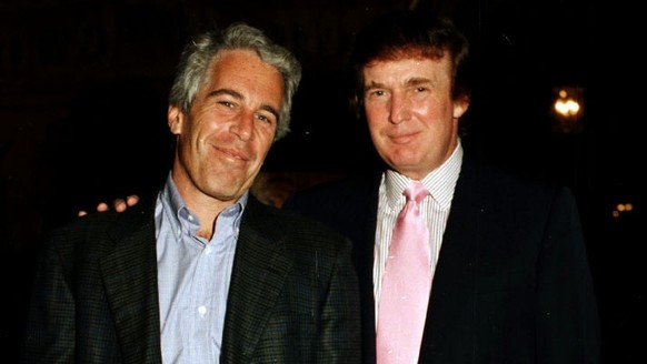 Portrait of American financier Jeffrey Epstein (left) and real estate developer Donald Trump as they pose together at the Mar-a-Lago estate, Palm Beach, Florida, 1997. (Photo by Davidoff Studios/Getty ...