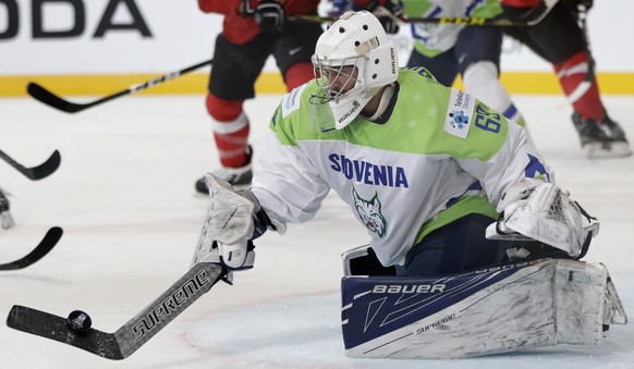 Slovenia&#039;s Matija Pintaric makes a save during the Ice Hockey World Championships group B match between Switzerland and Slovenia in the AccorHotels Arena in Paris, France, Saturday, May 6, 2017.  ...