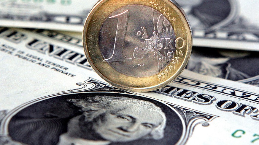 A Euro coin is placed on a one U.S. dollar note in a bank in a Gelsenkirchen, Germany file photo from July 5, 2005. The U.S. dollar fell Thursday to its lowest level against the British pound in 14 ye ...