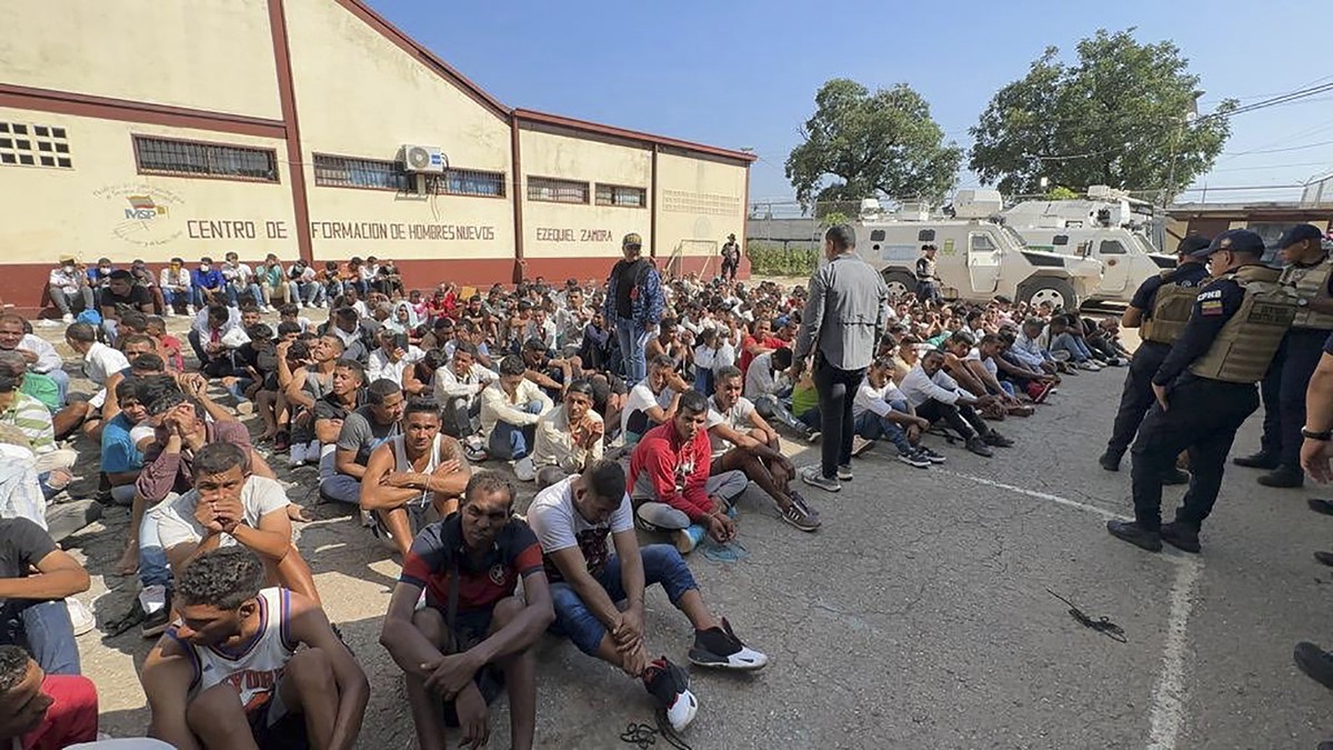 epa10874226 An undated handout photo made available by Venezuelan President Nicolas Maduro's official twitter (X) account shows inmates in the Tocoron prison waiting after being evacuated in a ma ...