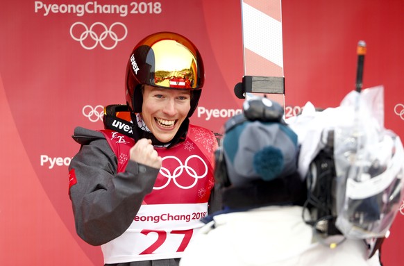 Franz-Josef Rehrl, of Austria, celebrates after the competition jump in the nordic combined event at the 2018 Winter Olympics in Pyeongchang, South Korea, Wednesday, Feb. 14, 2018. (AP Photo/Matthias  ...