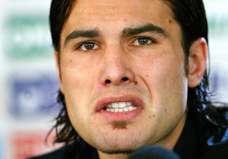 Former Chelsea striker Adrian Mutu speaks to reporters during a press conference in Bucharest, Romania, Tuesday Nov. 9 2004. Facing a seven-month ban after testing positive for cocaine, Mutu apologize ...