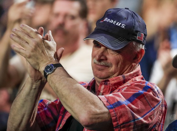 epa07530722 A man applauds as he listens to US President Donald J. Trump speak at the 2019 National Rifle Association (NRA) Annual Leadership Forum at Lucas Oil Stadium in Indianapolis, Indiana, USA,  ...