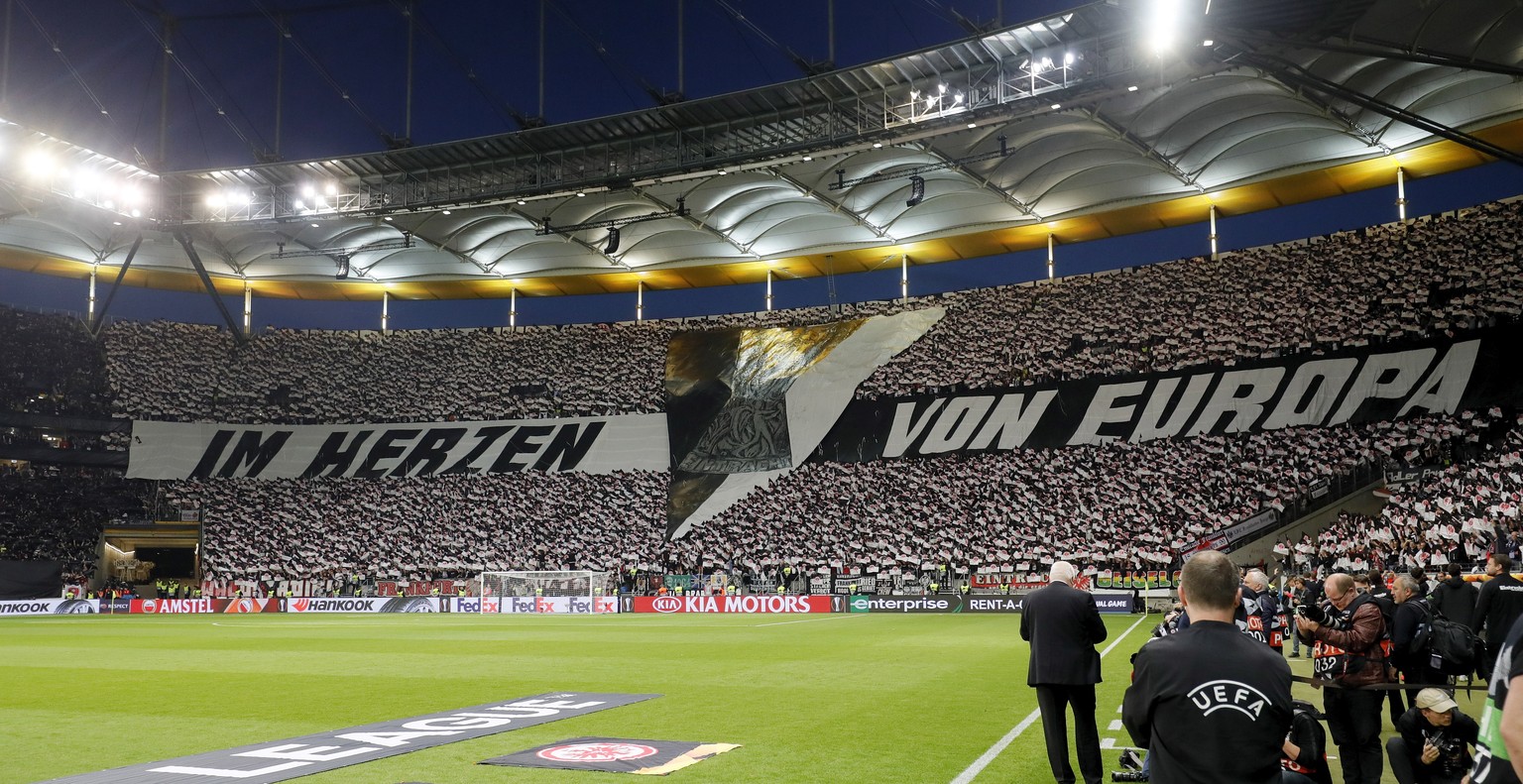 epa07514680 Frankurt fans wave with flags before the UEFA Europa League quarter final second leg soccer match between Eintracht Frankfurt and Benfica Lisbon in Frankfurt, Germany, 18 April 2019. EPA/R ...