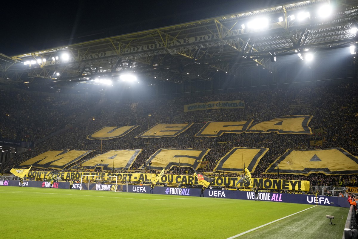 Dortmund fans raise banners against UEFA ahead of the Champions League opening phase soccer match between Borussia Dortmund and Celtic FC at the BVB Stadion in Dortmund, Germany, Tuesday, Oct. 1, 2024 ...