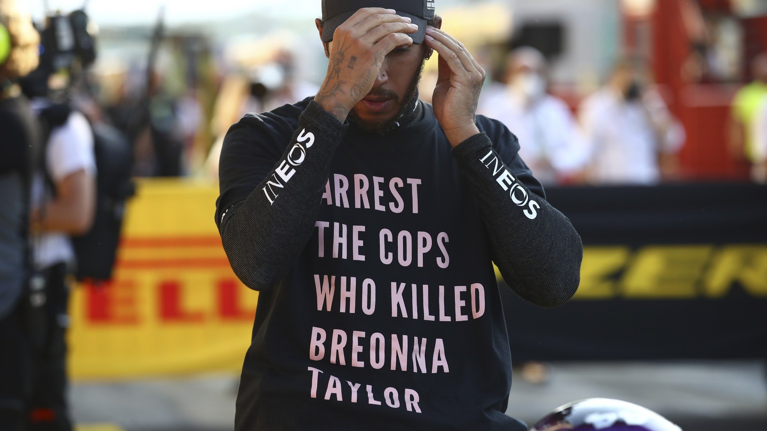 epa08666738 Winner British Formula One driver Lewis Hamilton of Mercedes-AMG Petronas reacts after the Formula One Grand Prix of Tuscany at the race track in Mugello, Italy 13 September 2020. EPA/Bryn ...