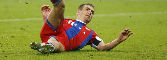 Bayern Munich&#039;s Philipp Lahm slips as he takes a penalty after extra time and misses, during their German Cup (DFB Pokal) semi-final soccer match against Borussia Dortmund in Munich, Germany Apri ...