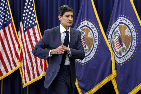 epa13045047 US Federal Reserve Board Chairman Kevin Warsh walks after a news conference at the Federal Reserve in Washington, DC, USA, 17 June 2026. The Federal Reserve announced that interest rates w ...