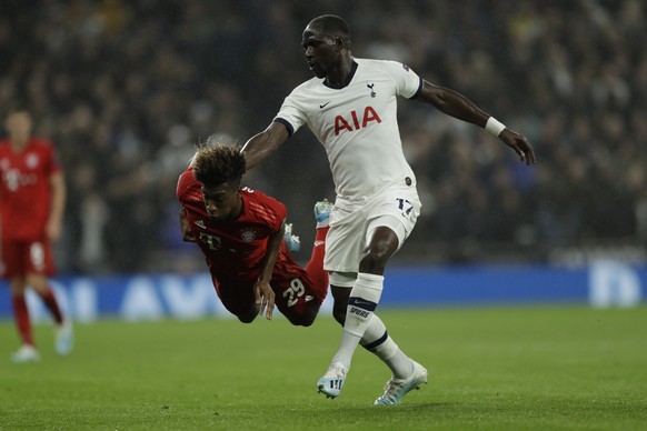 Tottenham&#039;s Moussa Sissoko, right, stops Bayern&#039;s Kingsley Coman during the Champions League group B soccer match between Tottenham and Bayern Munich at the Tottenham Hotspur stadium in Lond ...