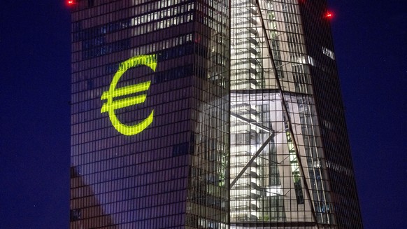 FILE - A light installation is projected onto the building of the European Central Bank during a rehearsal in Frankfurt, Germany, Dec. 30, 2021. Inflation hit a new record in the 19 countries that use ...