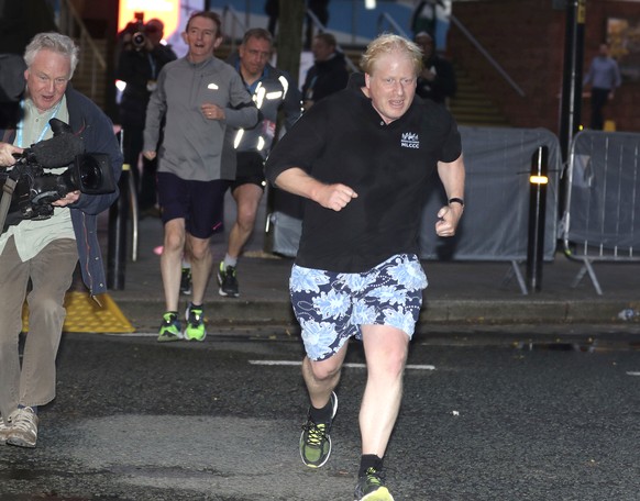 Britain&#039;s Foreign Secretary Boris Johnson goes for an early morning run while attending the Conservative Party Conference in Manchester, Tuesday Oct. 3, 2017. (Owen Humphreys/PA via AP)