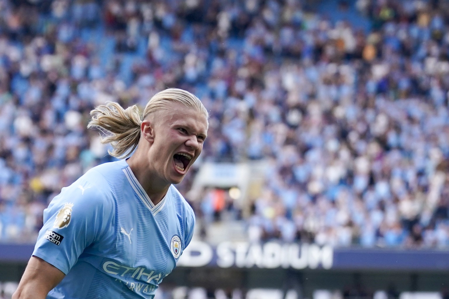 Manchester City&#039;s Erling Haaland celebrates after scoring his side&#039;s fifth goal during the English Premier League soccer match between Manchester City and Fulham at the Etihad stadium in Man ...