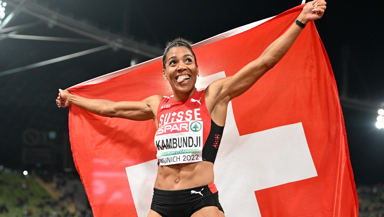 epa10129793 Mujinga Kambundji of Switzerland reacts after winning the women?s 200m final during the Athletics events at the European Championships Munich 2022, Munich, Germany, 19 August 2022. EPA/FIL ...