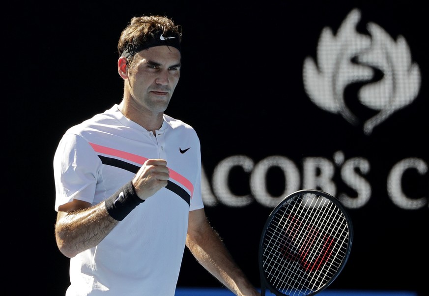 Switzerland&#039;s Roger Federer reacts after winning a point against Hungary&#039;s Marton Fucsovics during their fourth round match at the Australian Open tennis championships in Melbourne, Australi ...