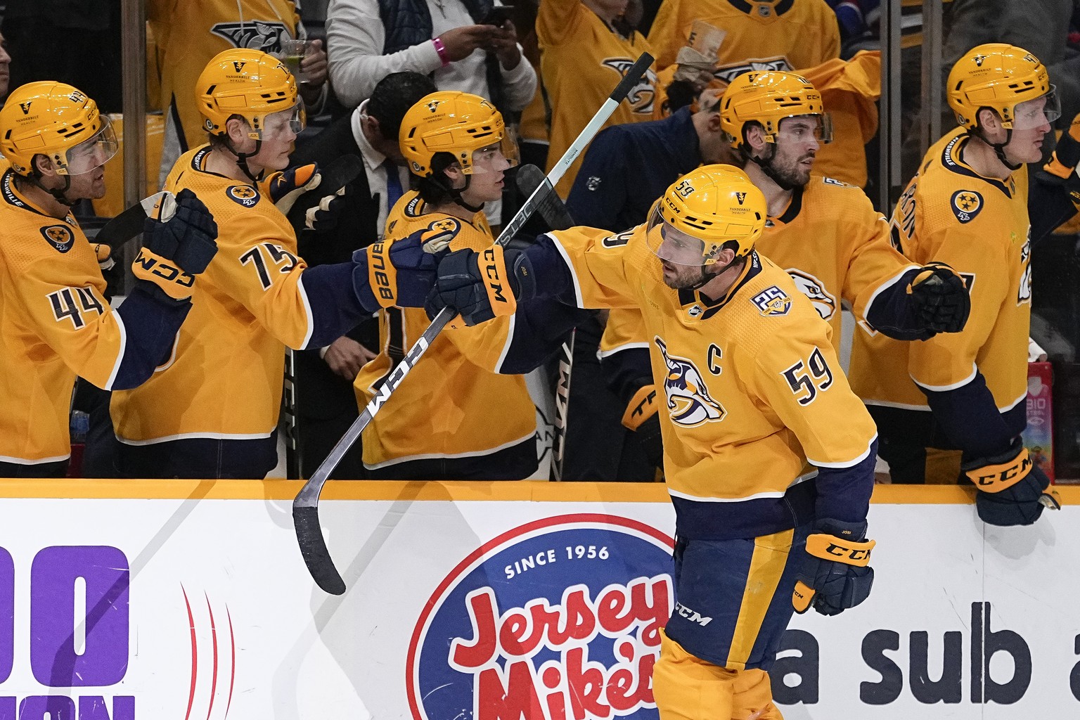 Nashville Predators defenseman Roman Josi (59) celebrates a goal with teammates during the first period of an NHL hockey game against the New York Rangers, Saturday, Dec. 2, 2023, in Nashville, Tenn.  ...