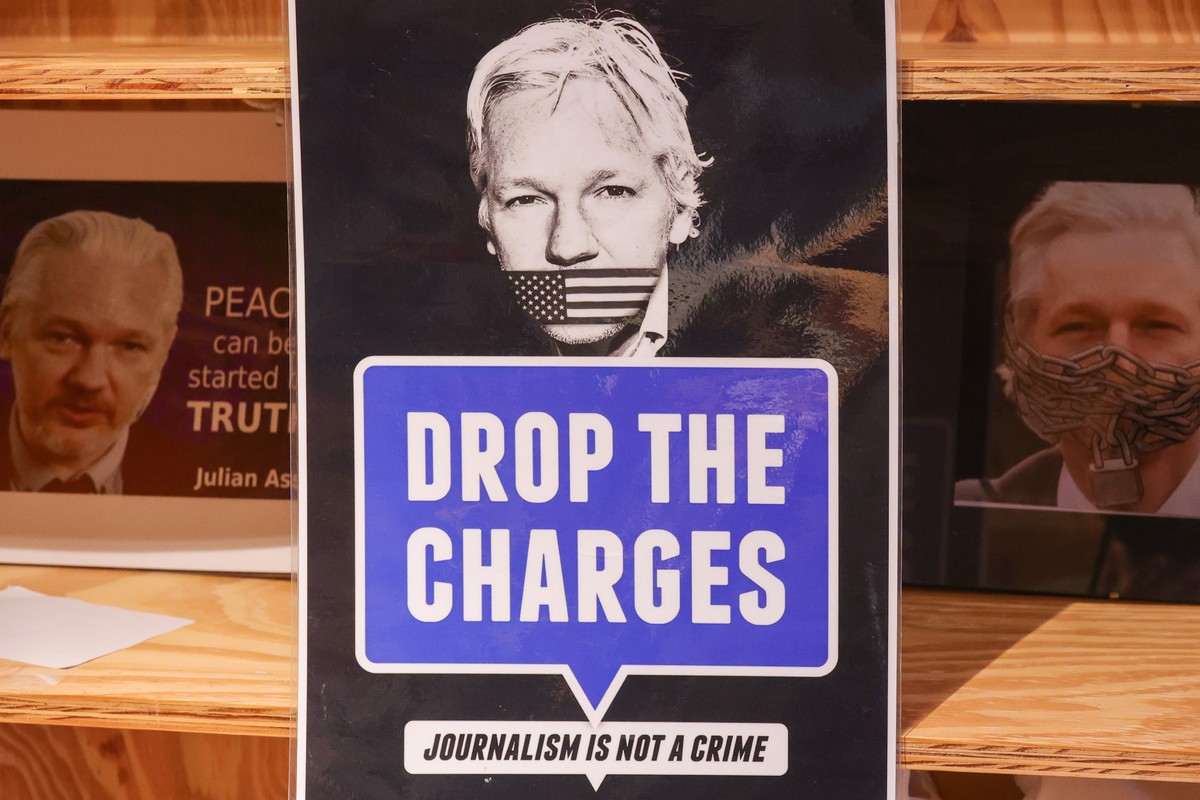 epaselect epa10568706 Signage during a protest to mark the fourth anniversary of WikiLeaks founder Julian Assange's detention in Thamesmead South-East London Belmarsh prison, in Brussels, Belgium ...