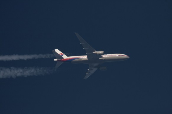 Boeing 777 Malaysian Airlines Flight MH370 with the registration number 9M-MRO flies over Poland February 5, 2014. Malaysia Airlines Flight MH370, with 239 people on board, dropped off air traffic con ...